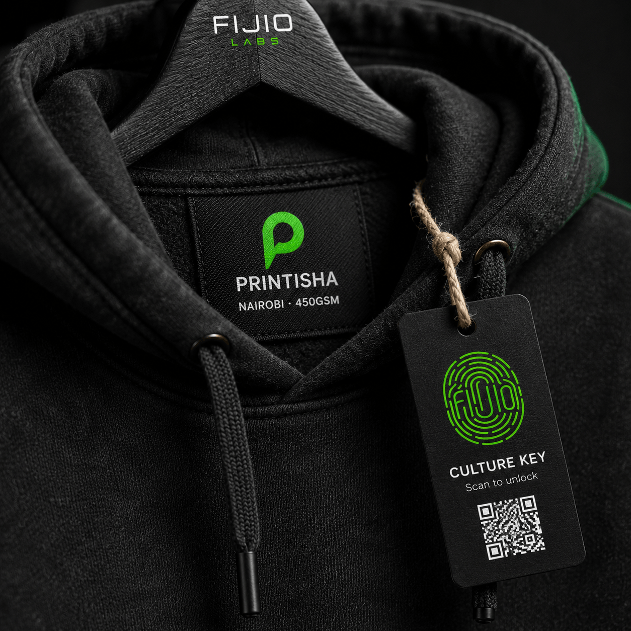 Close-up of the woven Printisha neck label and the Fijio Culture Key scan tag on the hoodie