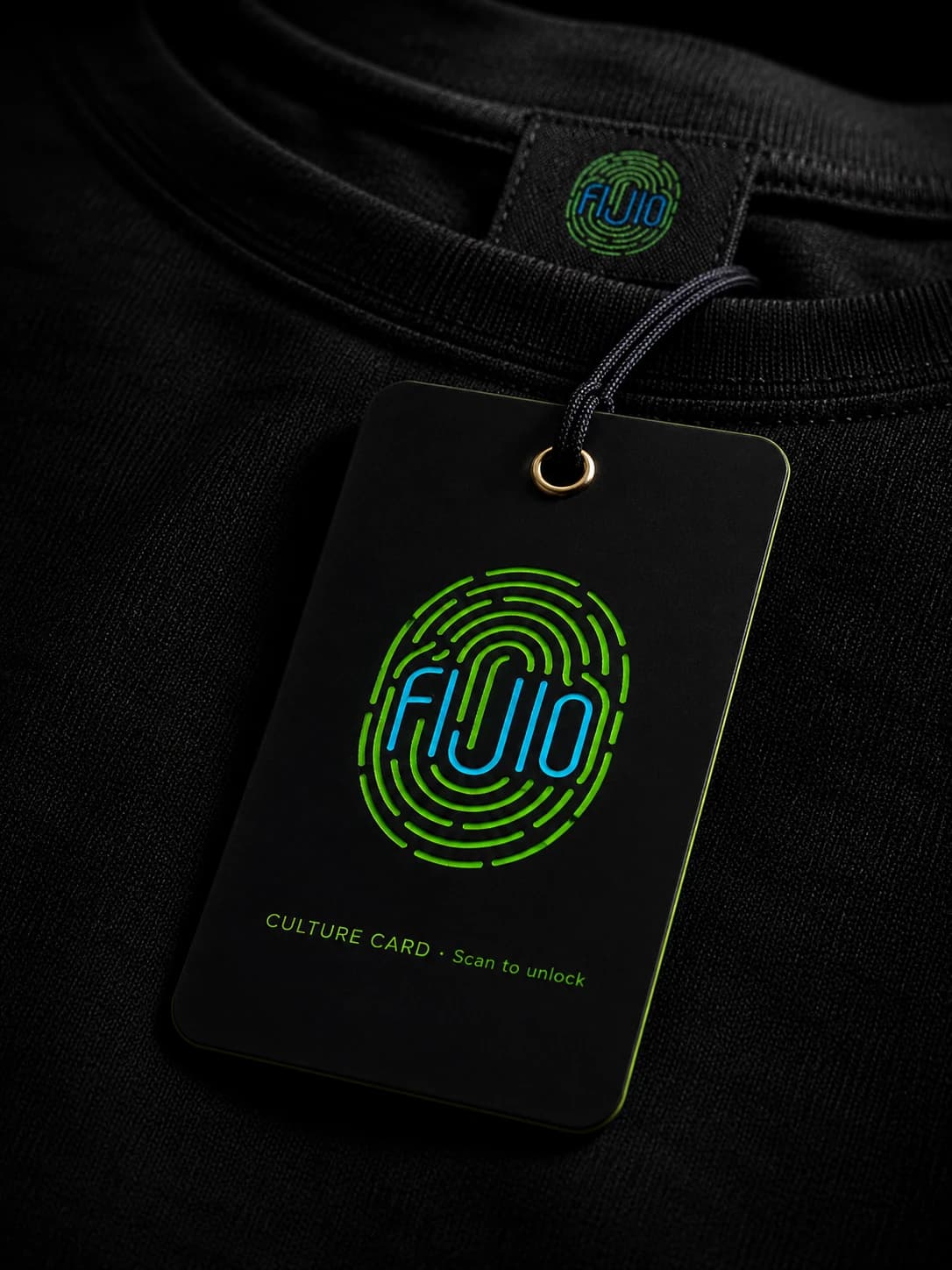 A FIJIO Culture Card hangtag attached to a folded black Printisha t-shirt, the Culture Key mark glowing green and blue