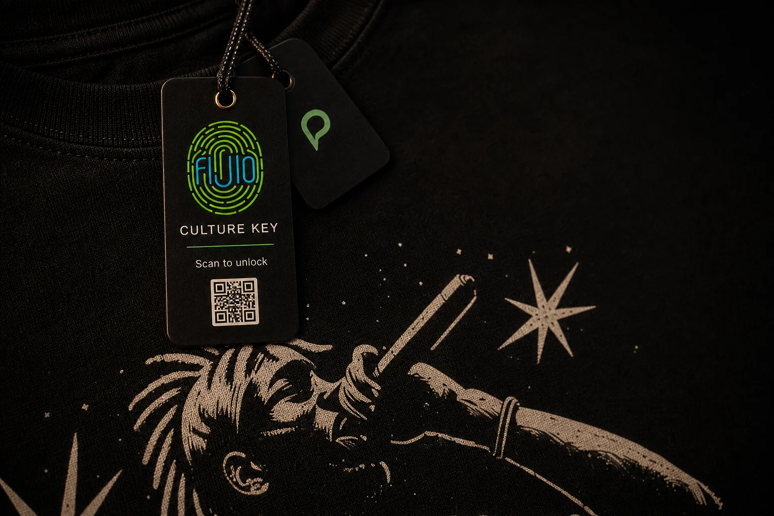 The FIJIO Culture Key and Printisha tag attached to the AMARI singer T-shirt